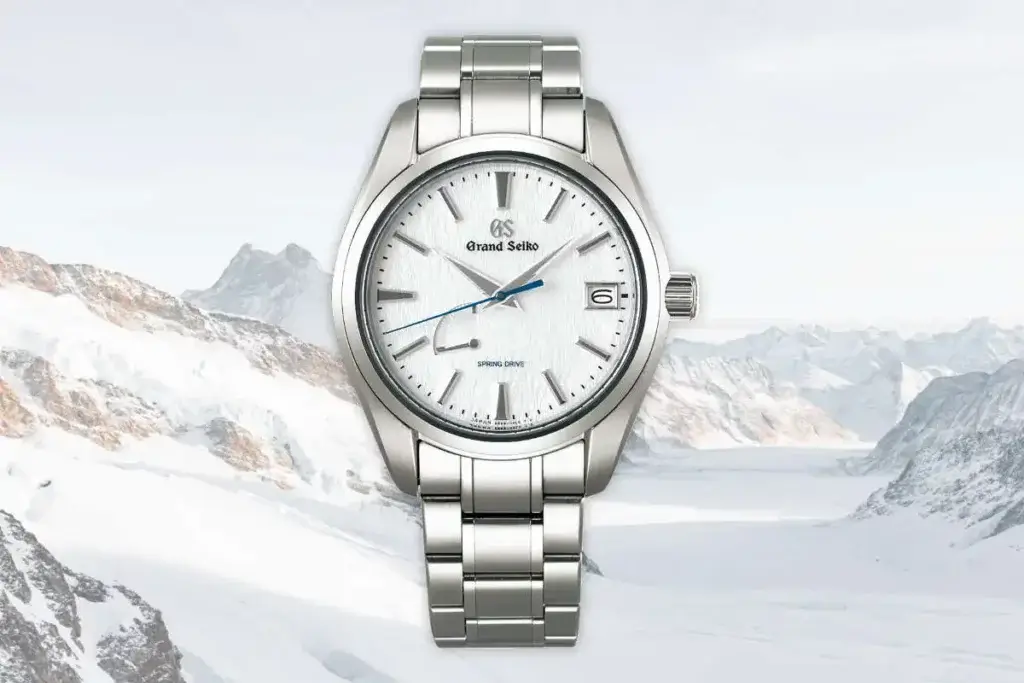 Famous Grand Seiko Snowflake, reference SBGA211, wristwatch pictured in the snowy mountains.