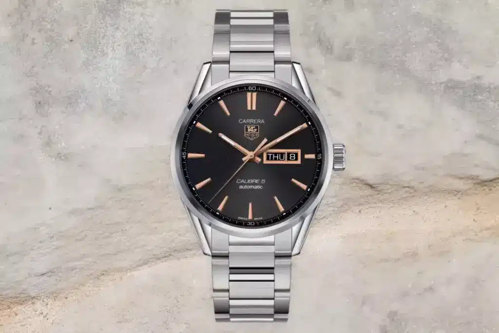 Tag Heuer's Carrera day-date watch in dark grey with rose gold accents powered by Calibre 5 movement.