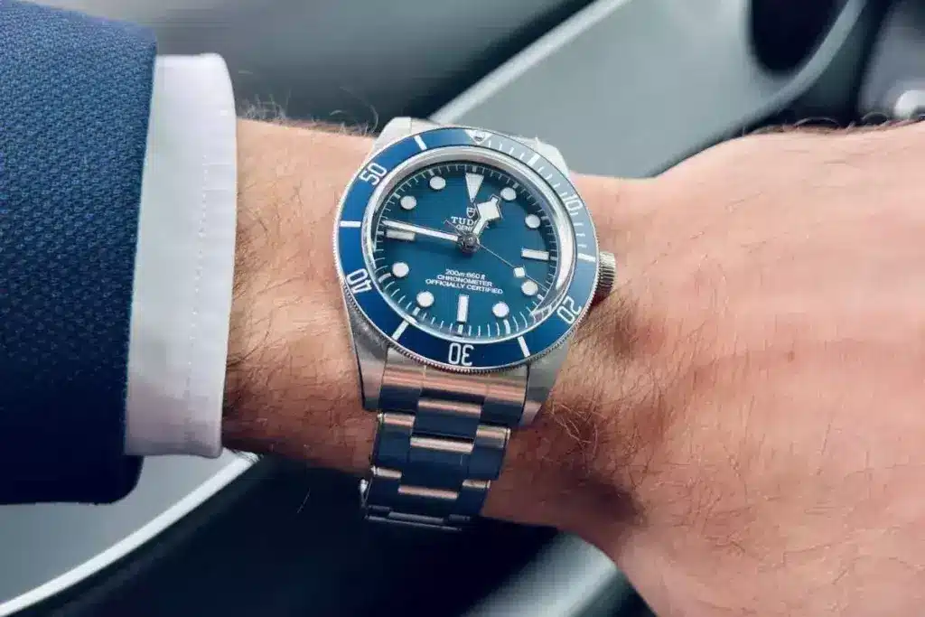 Tudor Black Bay Fifty Eight in navy blue captured on the wrist paired with a blue suit.