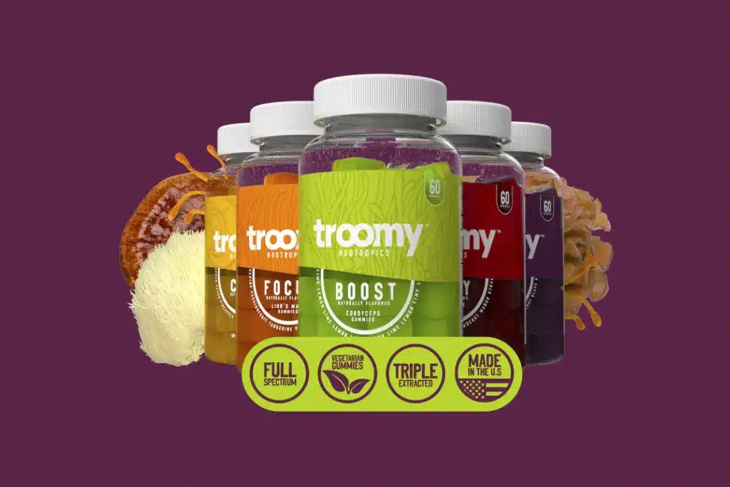 A photograph showing the Troomy supplements - all-natural functional mushroom gummies to improve energy, focus, calmness, sleep, and overall wellness with 14 super mushrooms.