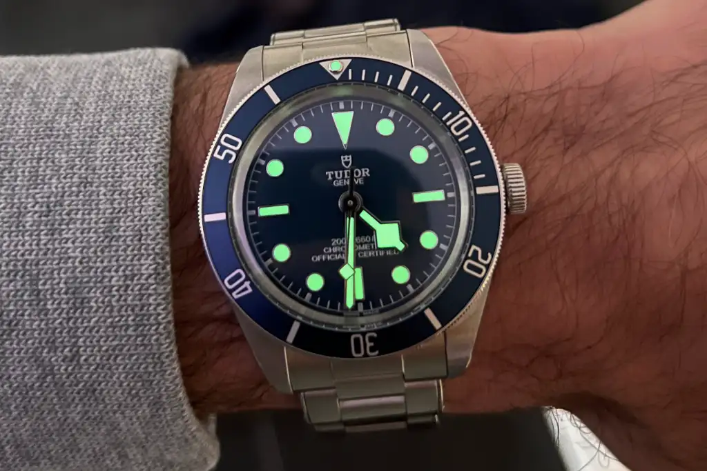 The Tudor Black Bay 58's green lume shown on the watch, which is great for visibility on a diver's watch, especially underwater.